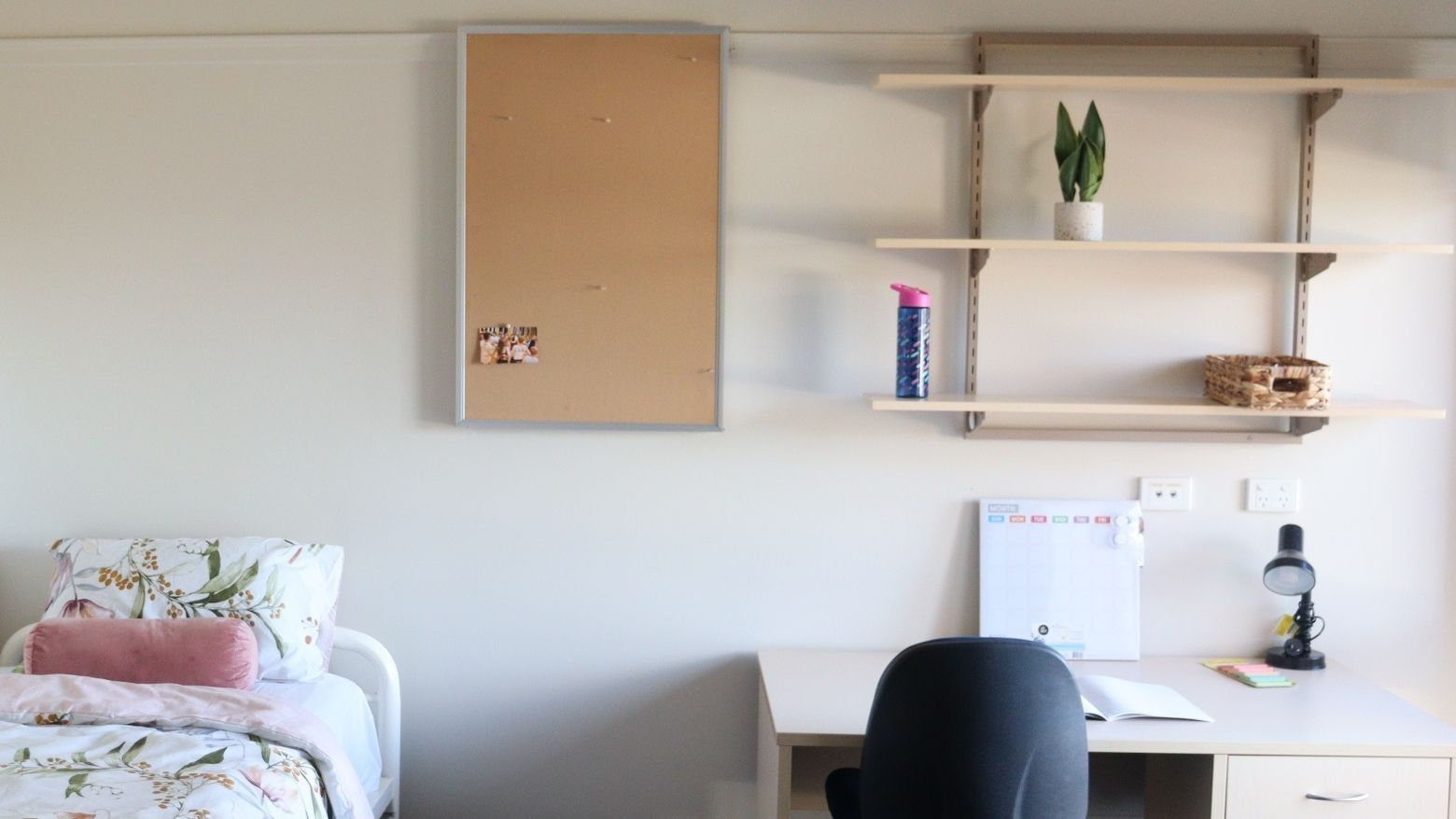 A tidy room with a bed and desk at La Trobe University - Terraces.