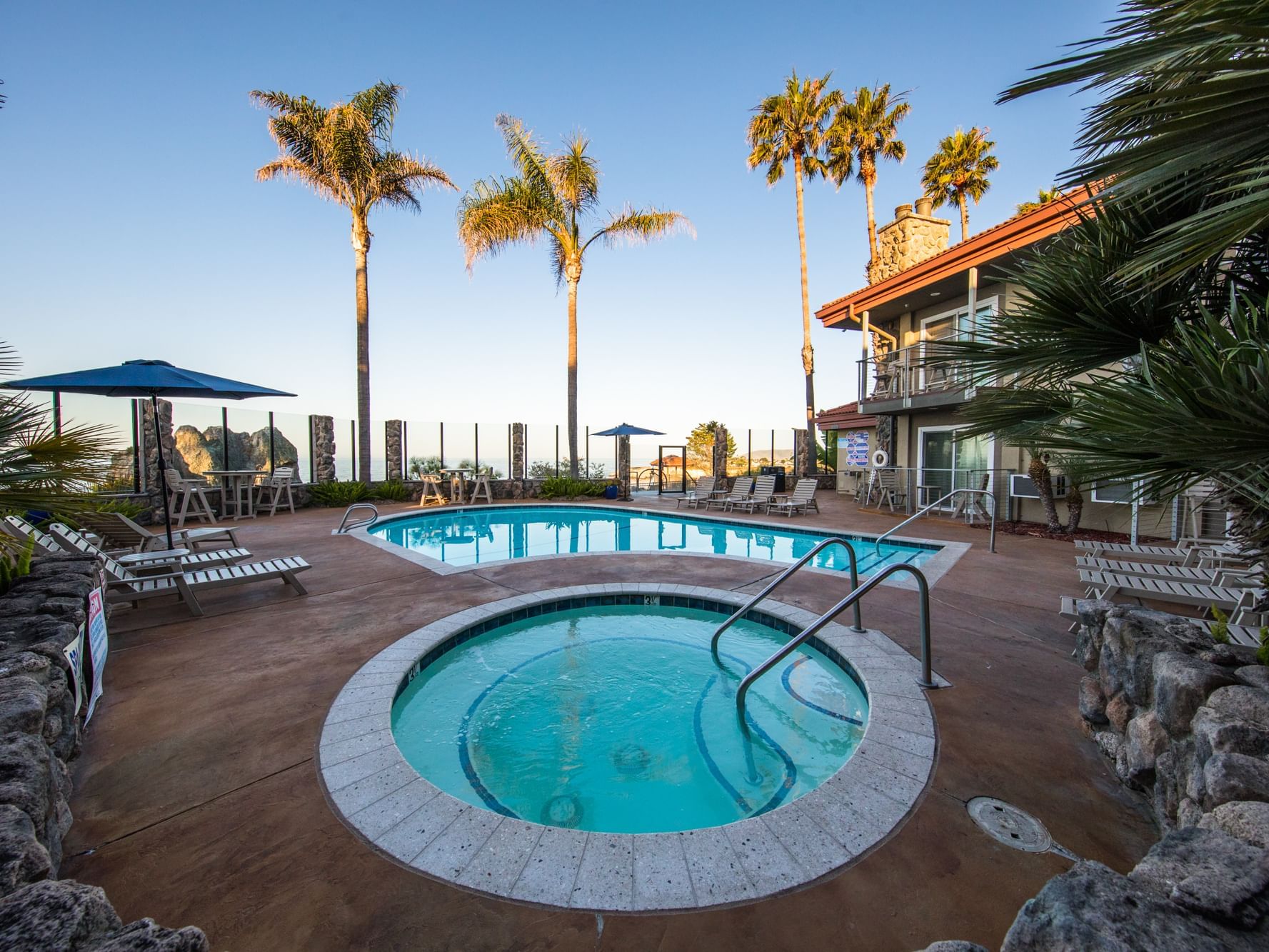Heated pool and tub with palm trees