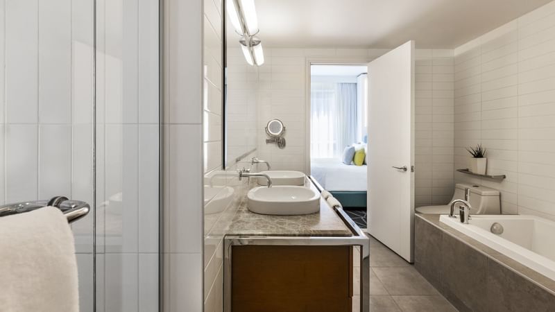 Crystal Suite bathroom with vanity area and bathtub at Warwick Le Crystal