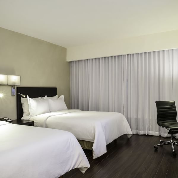Two double beds with TV in Superior Room at Fiesta Inn