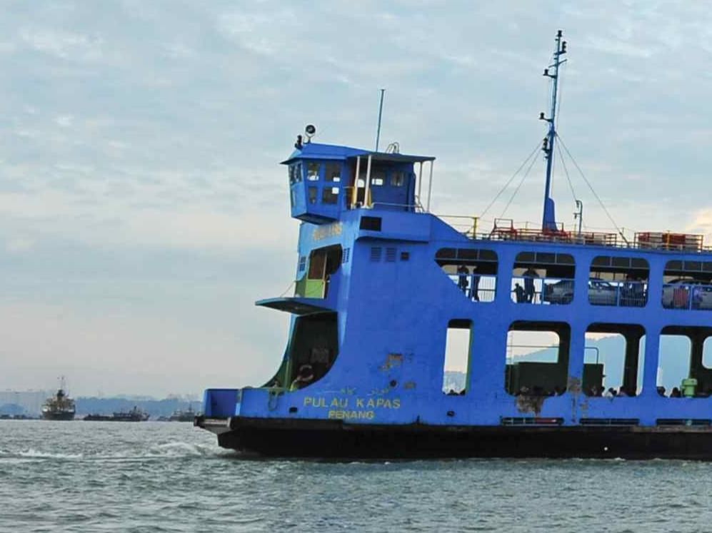 Blue ferry ship sailing in the sea in Butterworth near Sunway Hotel Seberang Jaya