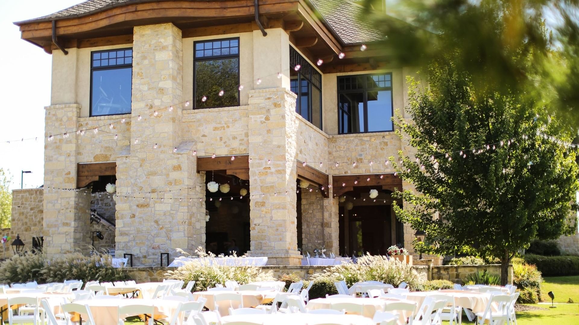 Stone building with large windows and wooden accents on the North Patio at Shangri-La Monkey Island