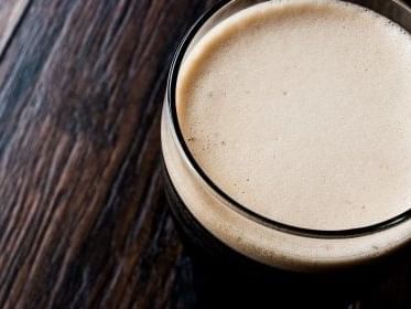 Close-up of stout beer head at Fado Irish Pub near Kinzie Hotel