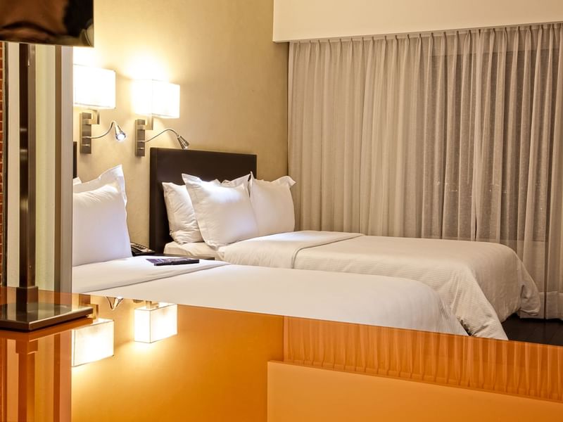 Close up on the single twin beds a room at Fiesta Inn