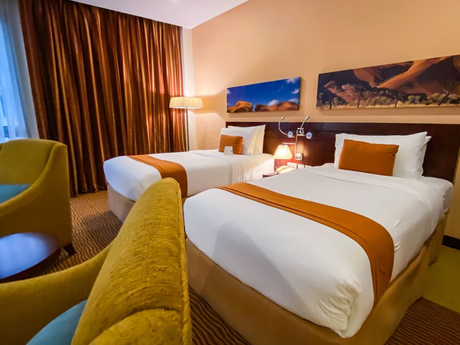 2 Beds & lounge area in Deluxe Room at City Seasons Hotels