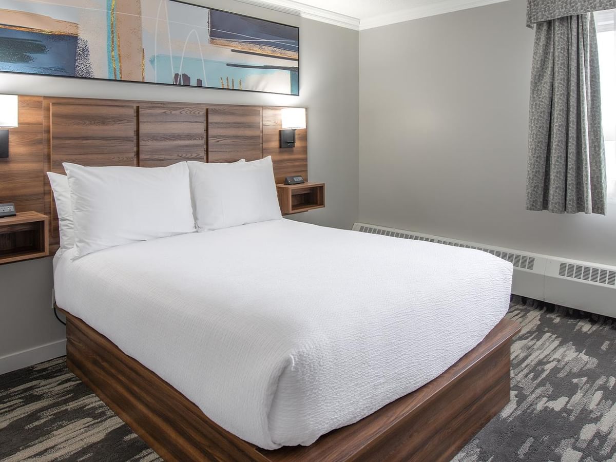 Hotel room with queen bed.