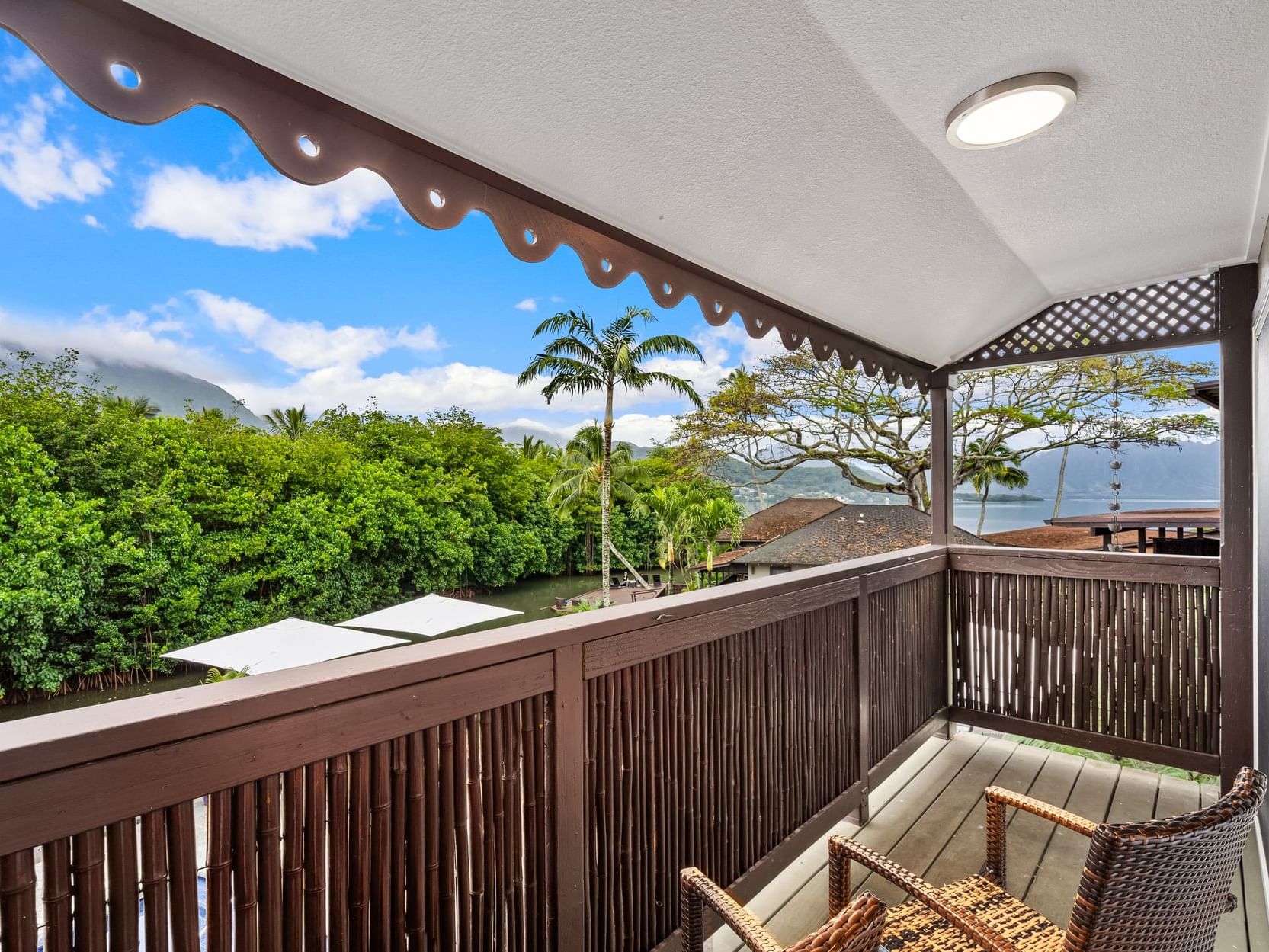 Balcony lounge area overlooking the Sea & mountains at Paradise Bay Resort