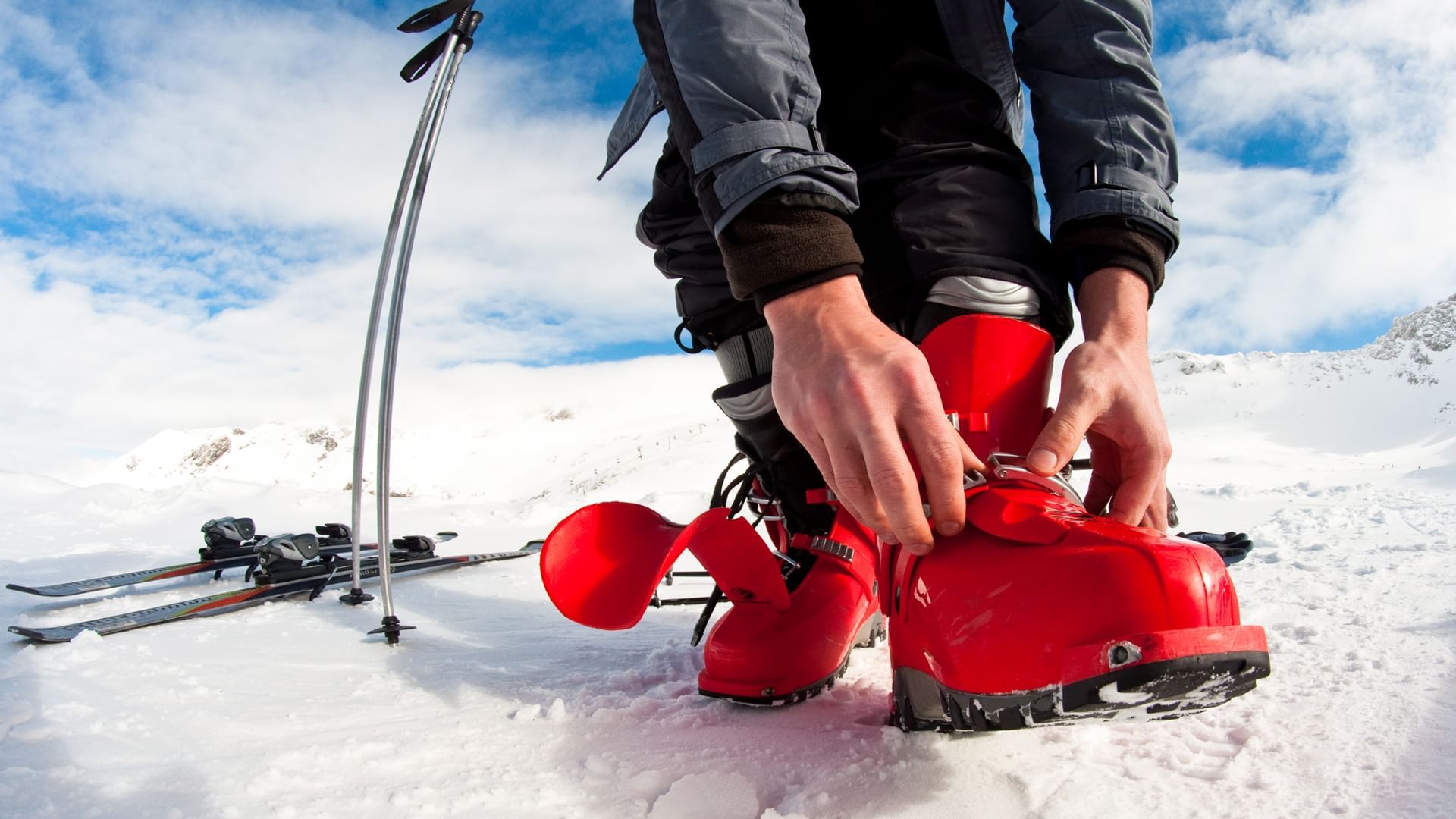 Fastening the boots for skiing near Village Hotels Manchester