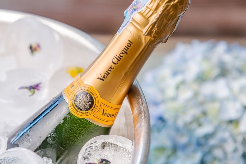 Close-up of a Veuve Clicquot champagne bottle resting in a bucket of ice at Park Hyatt Saigon
