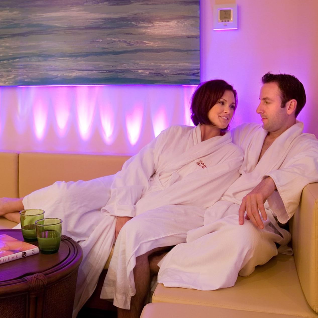 Couple with robes relaxing in Reflection Spa and Salon at Lake Buena Vista Resort Village & Spa
