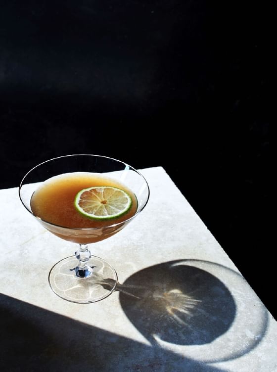 Closeup on a cocktail served on a table at Paradox Hotels