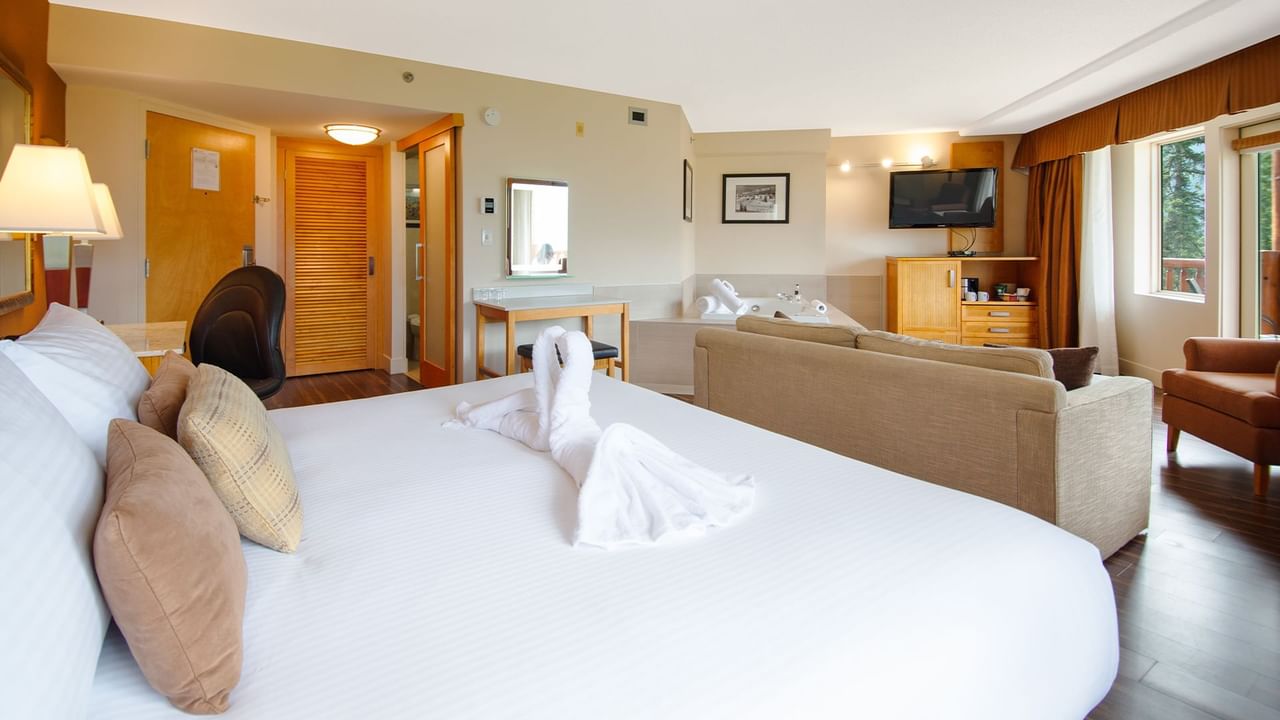 Hotel suite with king bed and a jetted tub