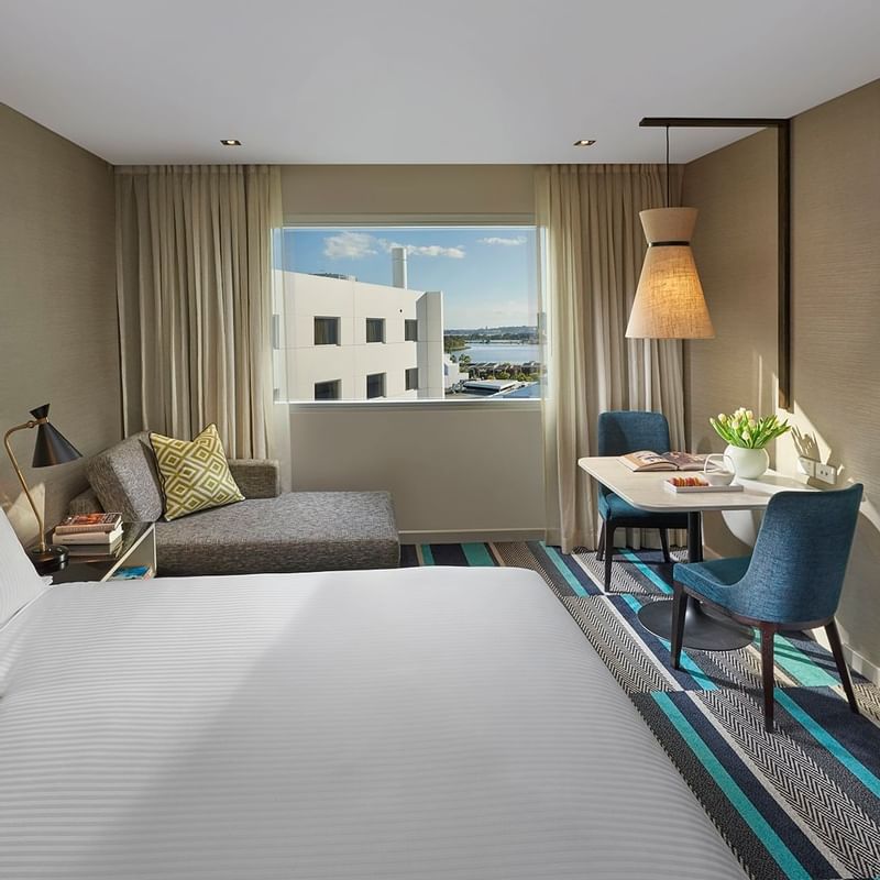 Bed & furniture in Superior King Room at Crown Promenade Perth