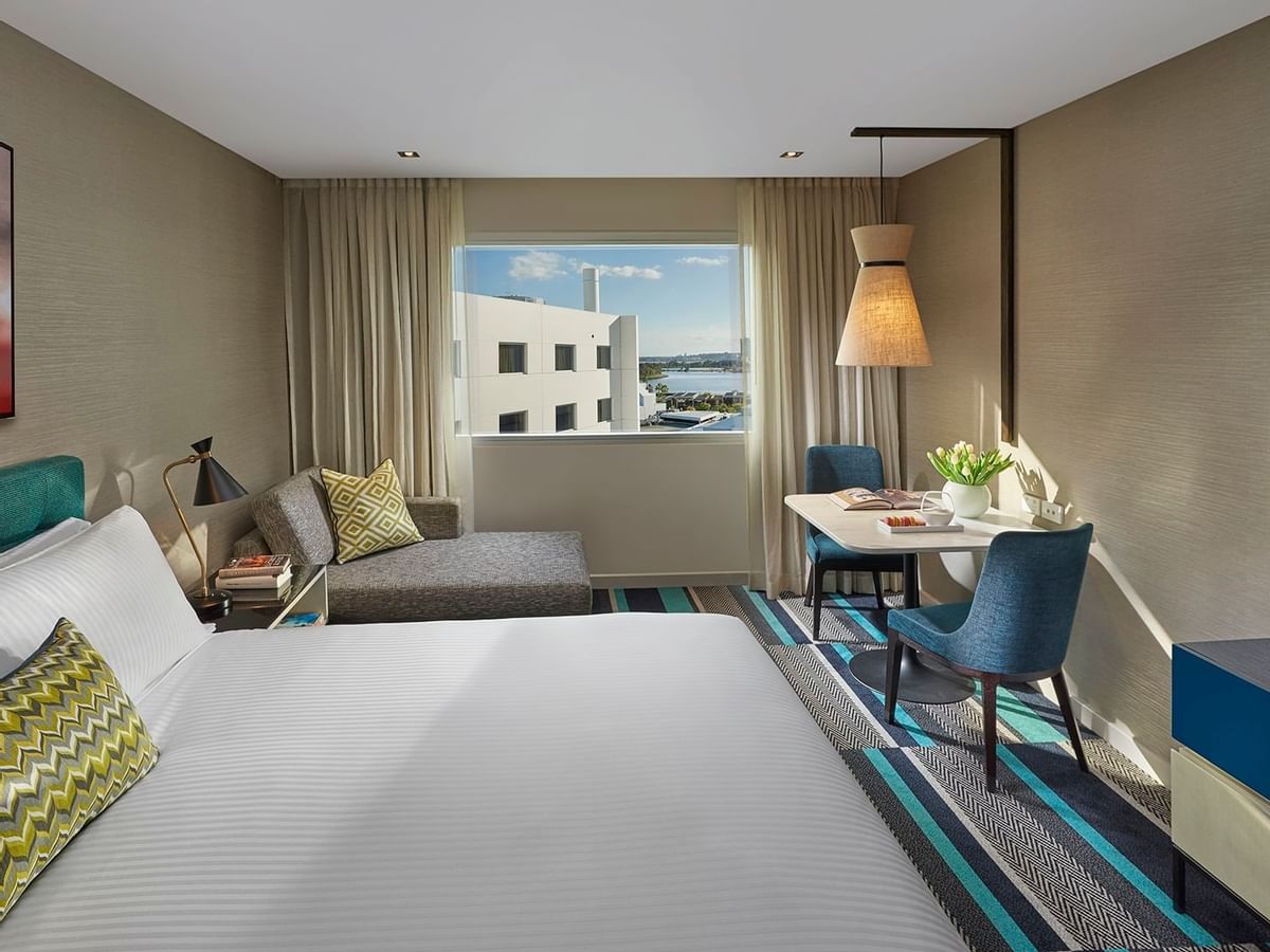 Bed & furniture in Superior King Room at Crown Promenade Perth