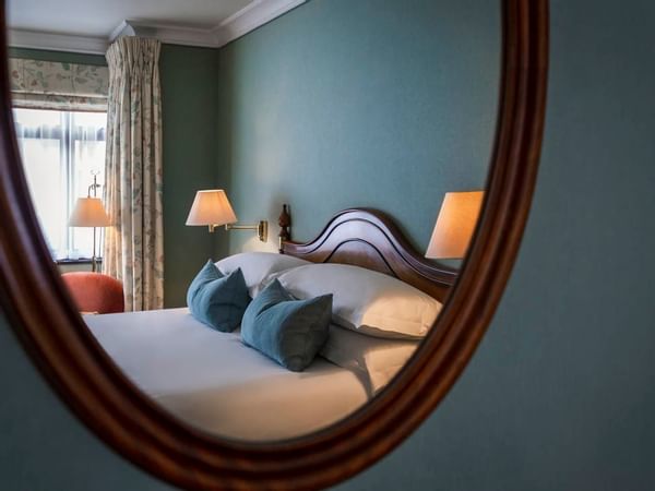 Room Bed View on a Mirror at The Capital By Warwick