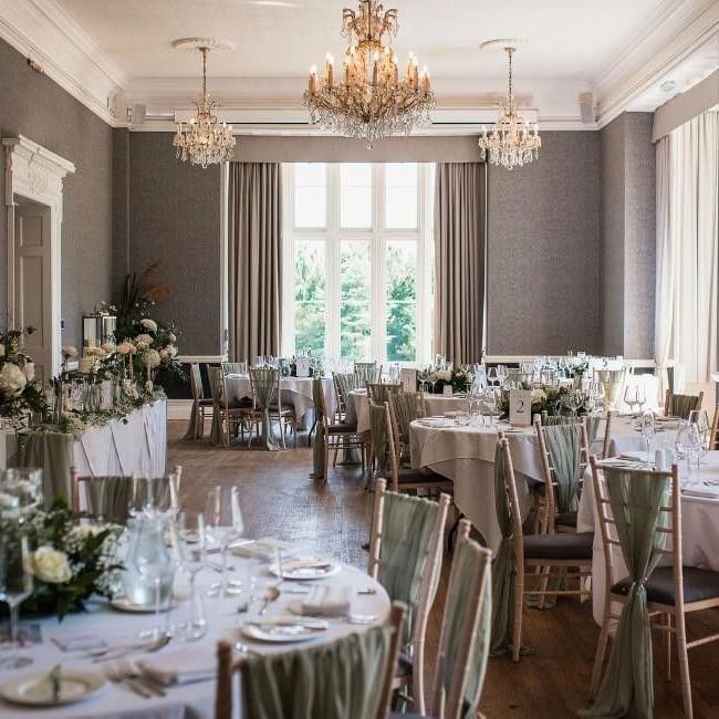 Wedding breakfast set up in ballroom featuring our article on 