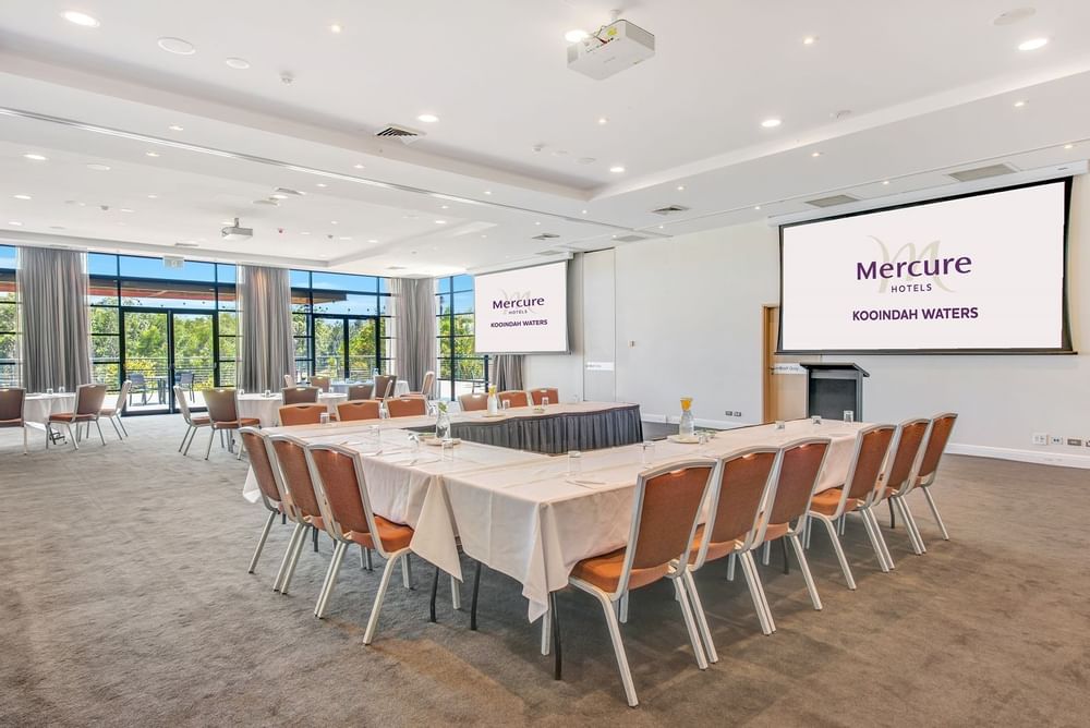 Interior of Kooindah 2 with U-shaped table setting at Mercure Kooindah Waters