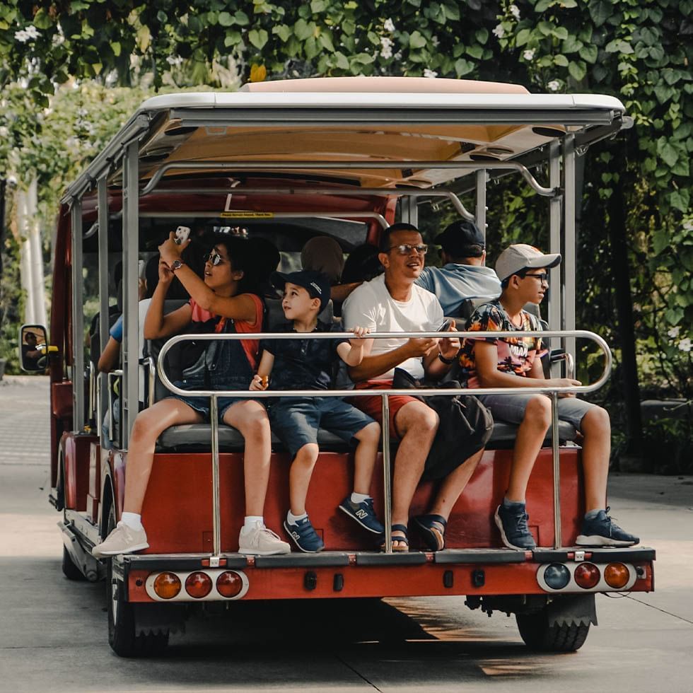 People enjoying a shuttle bus service near Falkensteiner Hotels