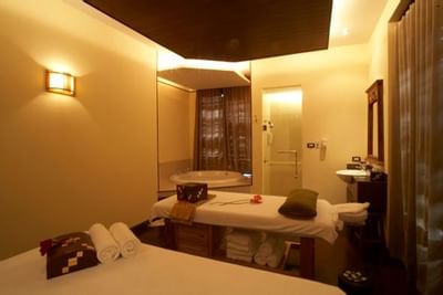 Well-arranged spa beds with towels at Amora Hotel Chiang Mai