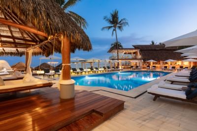 Outdoor pool area with lounges at Villa Premiere Boutique Hotel & Romantic Getaway