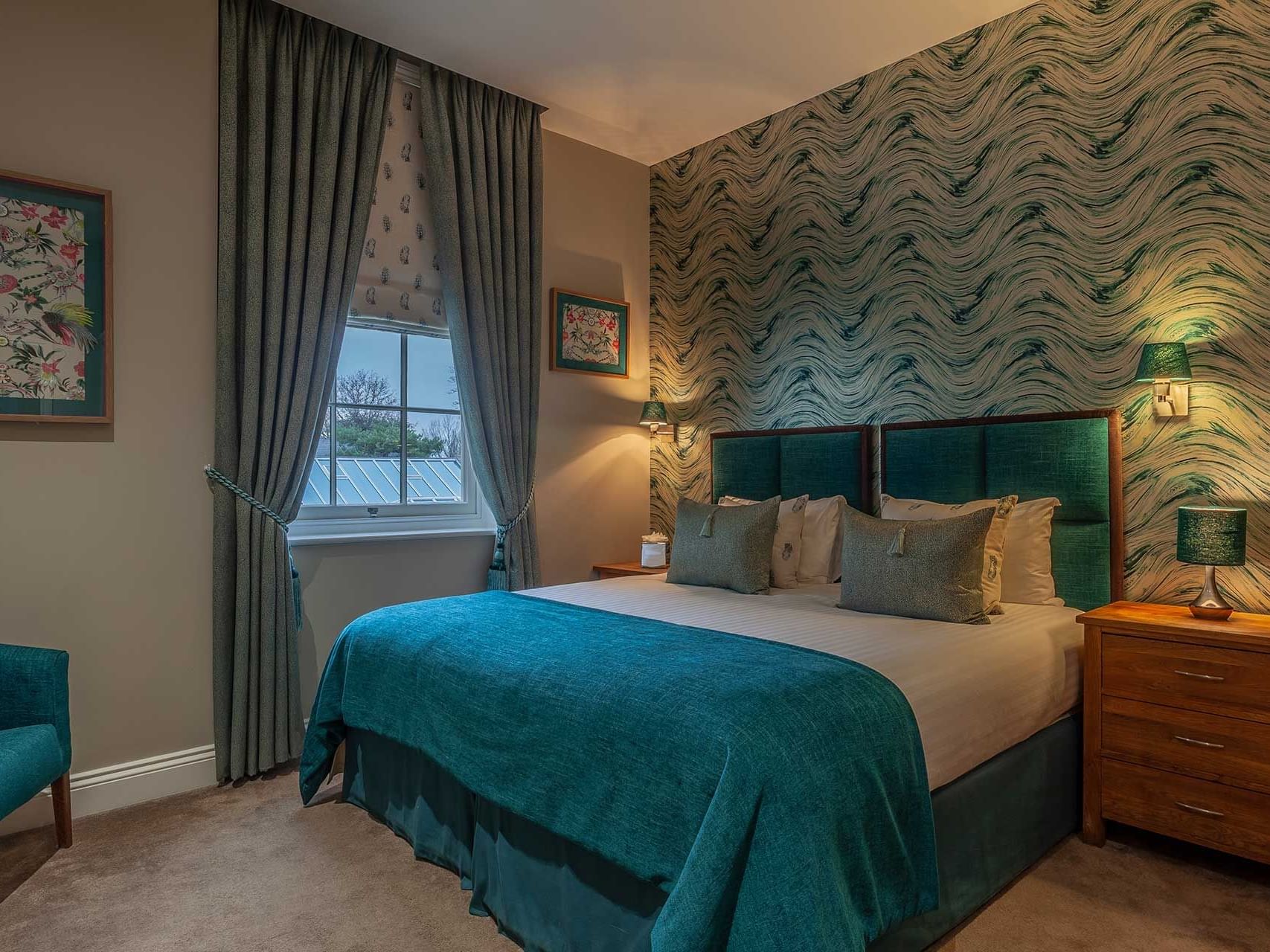 Comfortable bed in a Superior room at Orsett Hall Hotel