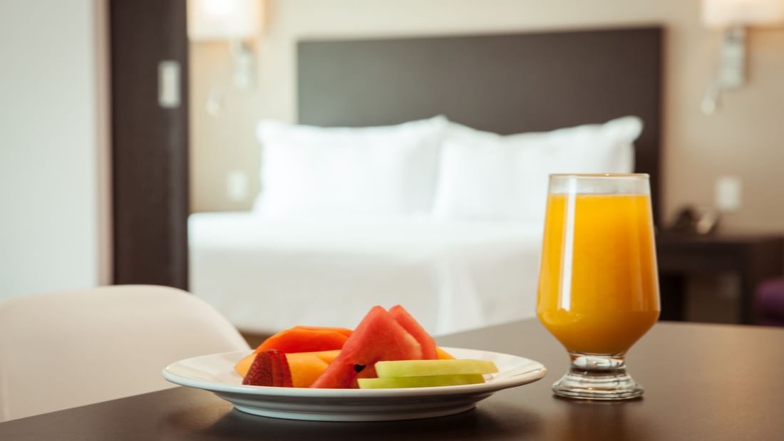 Fruit plate & juice served at Accessible Room in Fiesta Inn