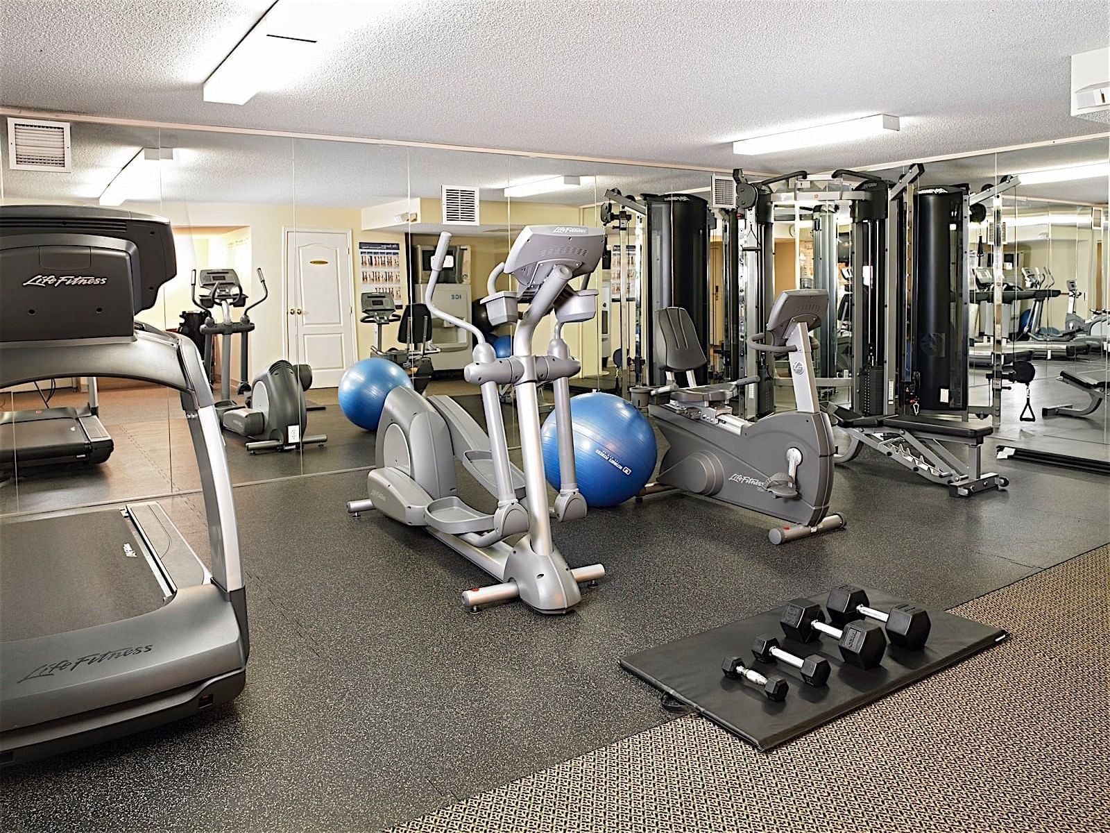 Dumbells, Cardio machines & other training equipment in hotel fitness center at Varscona Hotel on Whyte