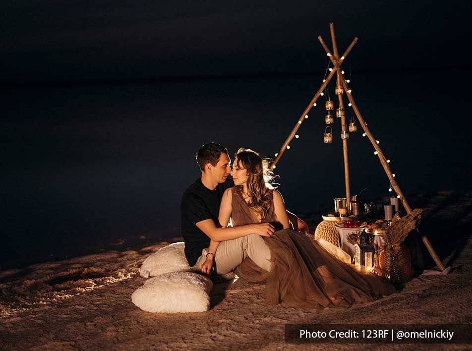 couple having romantic date night at the beach - Grand Lexis PD