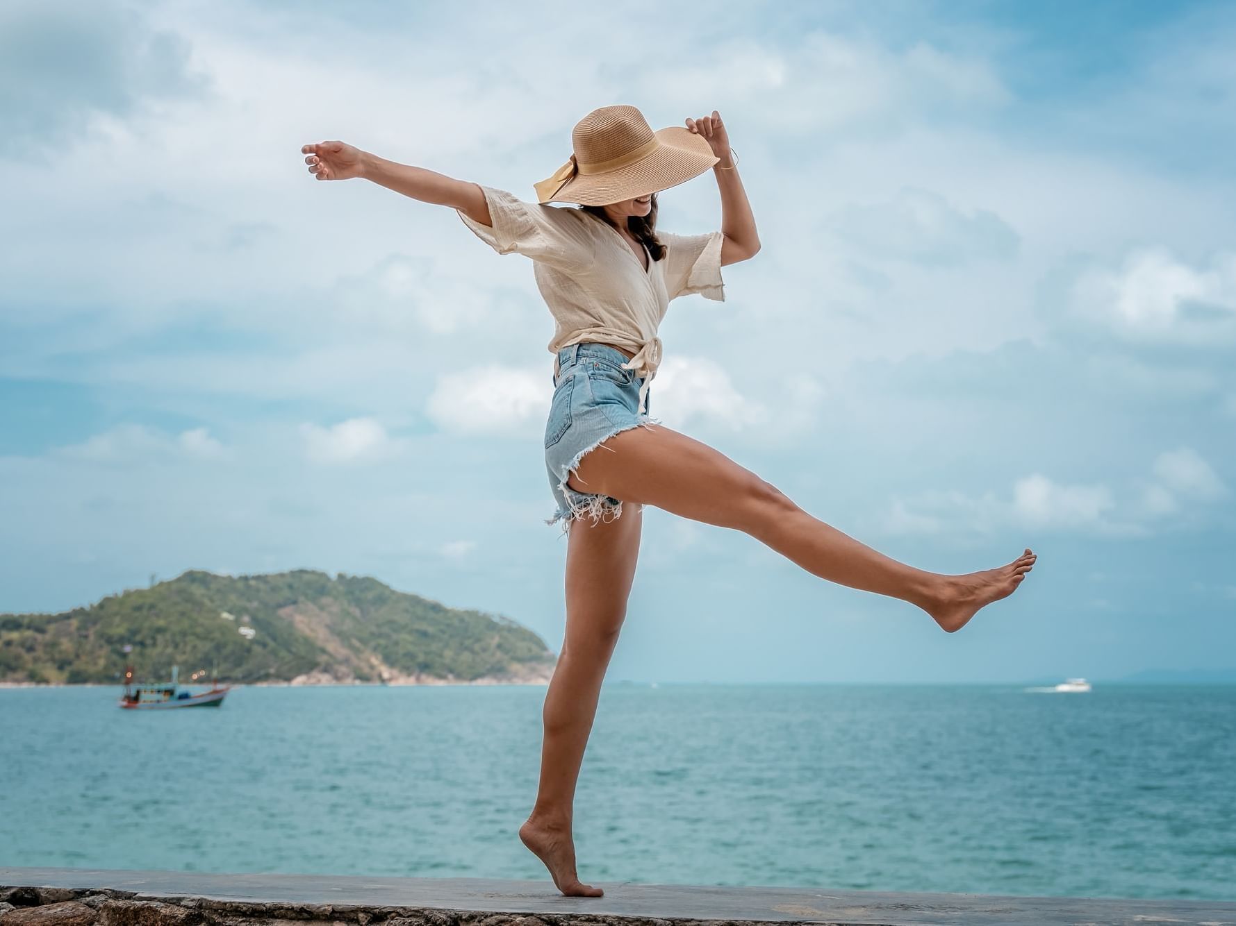 Girl running & jumping for joy at Daydream Island Resort
