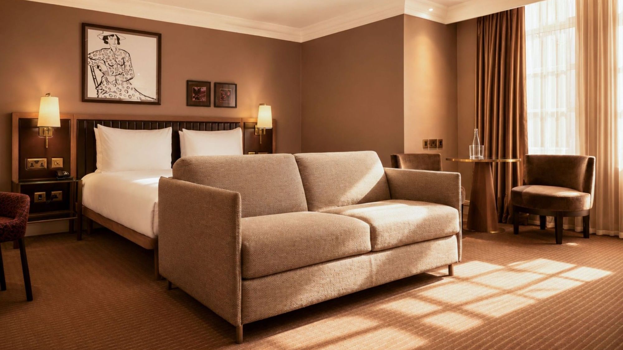 Collection Premium Executive Room with beige sofa bed, king bed and warm lighting at The May Fair Hotel, London.
