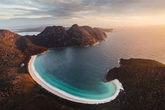 Aerial view of the Wineglass Bay at sunset near Freycinet Lodge