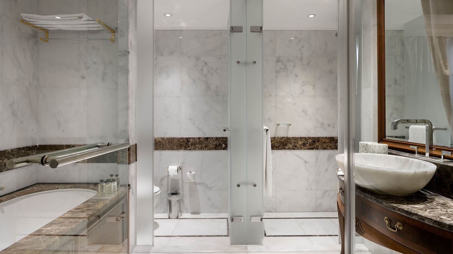 Bathtub and shower area in Premium Sea/Pool View Room at Titanic Mardan Palace