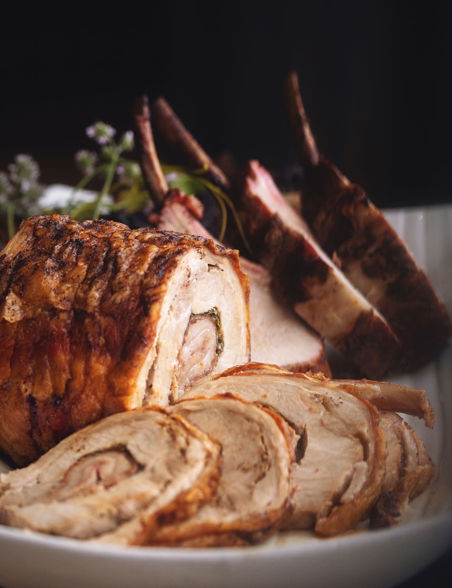 Lorem ipsum Stuffed pork loin sliced and plated