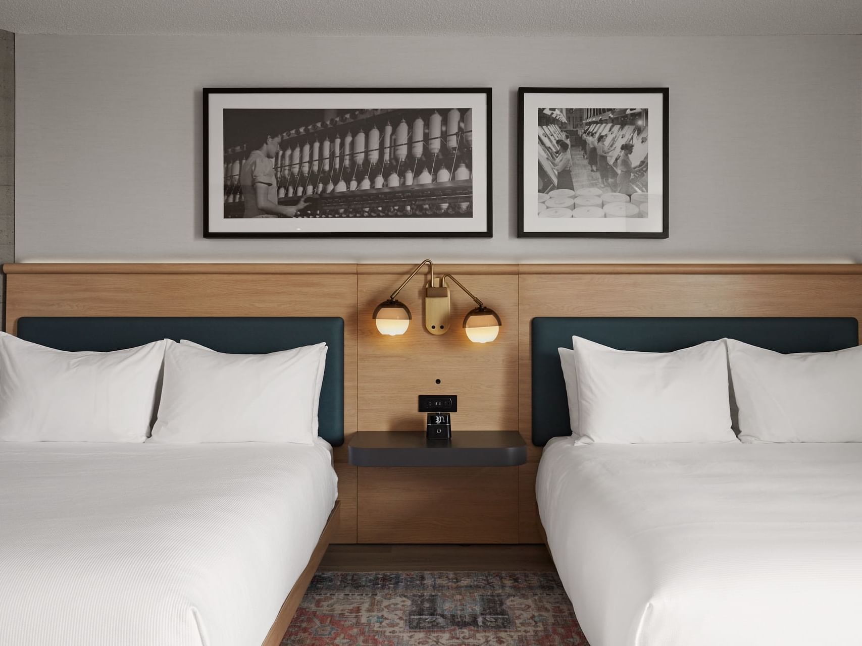 Art hung by the bed in The Moco 2-Queen Beds at Hotel Moco