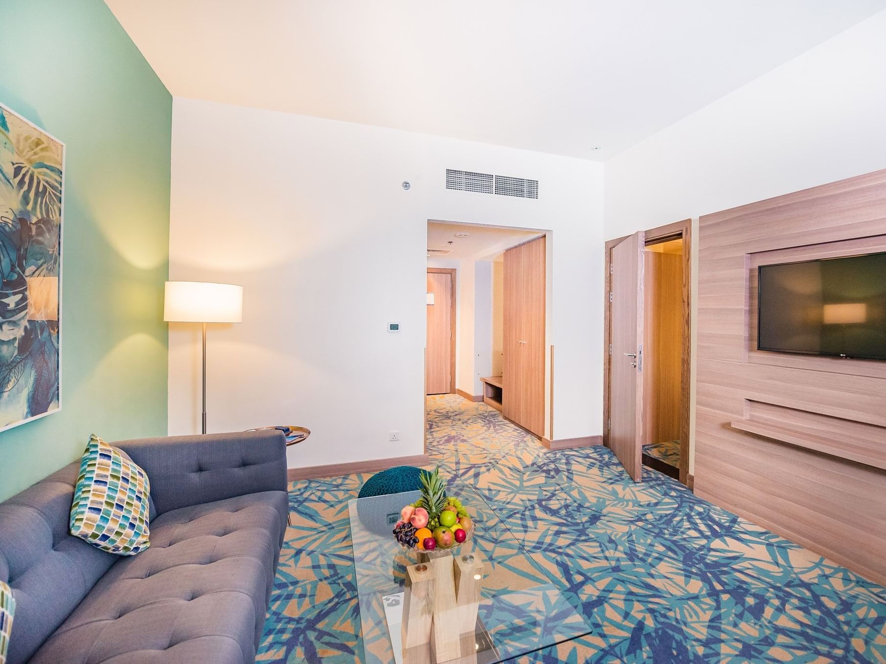 TV & Living area of junior suite at Mena Plaza Hotel