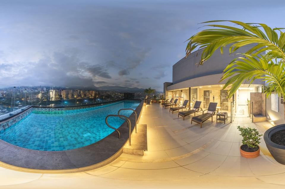 Exterior of the terrace pool with lounges at Blue Doors Hotels