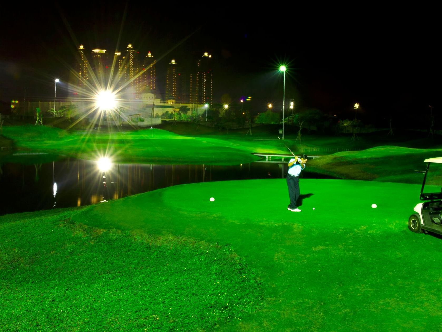 Man playing at night in Pakuwon Golf near Vasa Hotel Surabaya