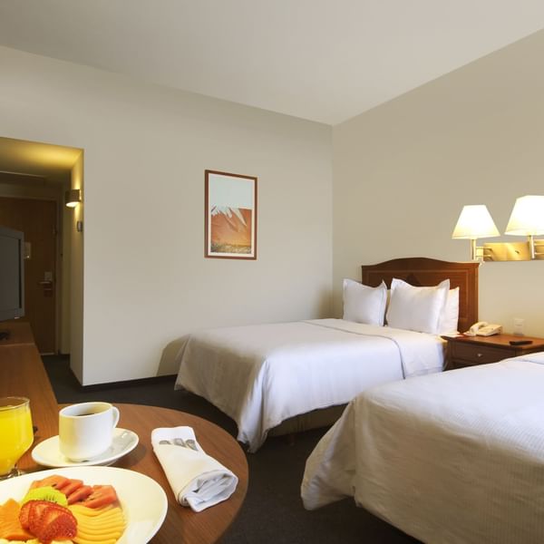 Fruit plate served with drinks in Superior Room at Fiesta Inn