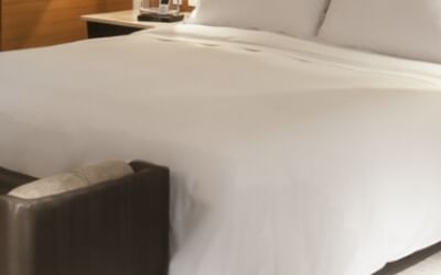 Bed in Deluxe room one king at Live Aqua Urban Resort México