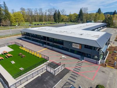 Aerial view of the L-shaped building and outdoor lounge area at The Varsity South