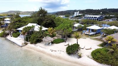 Aerial view of beach bungalows and white sand at Barefoot Cay Resort & Marina