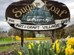 Logo for Sugar Loaf Arts and Craft Village