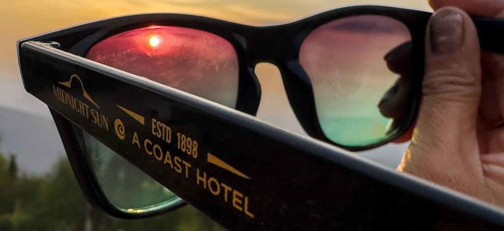 Midnight Sun Sunglasses with the sun in the lens