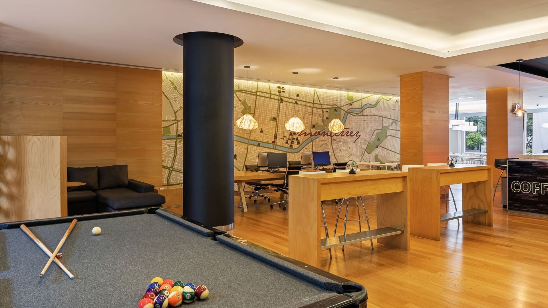 Pool table and modern wooden furniture in lobby area at Fiesta Inn Veracruz Boca del Río