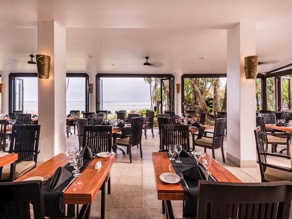 Dining area in Bula Brasserie with a ocean view at Warwick Fiji