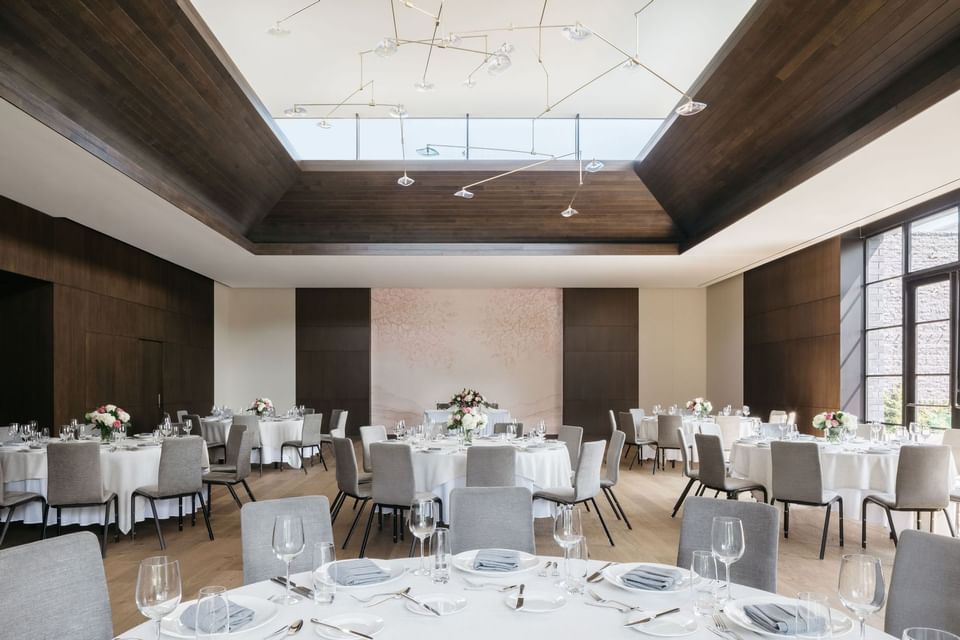 Winter Garden with banquets setting and atrium windows in The Study at the University of Chicago