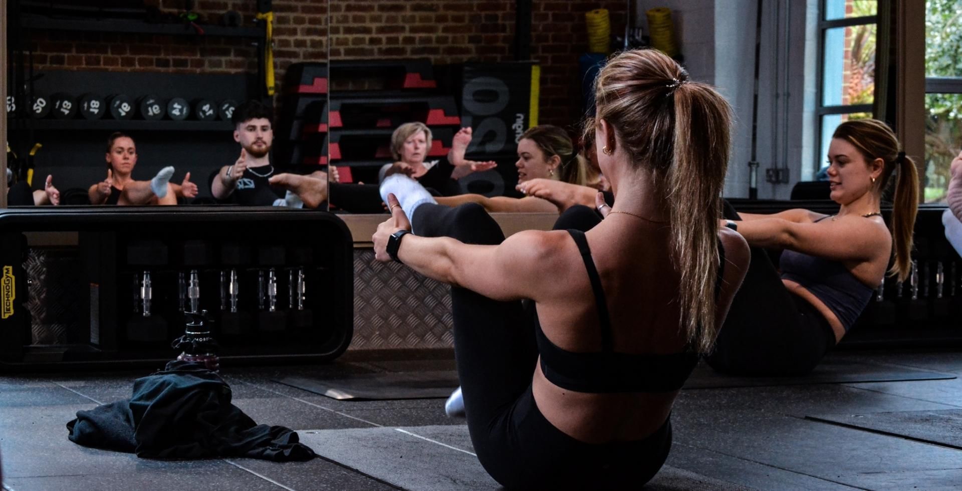 Close-up of a group doing Yoga at East Park Gym