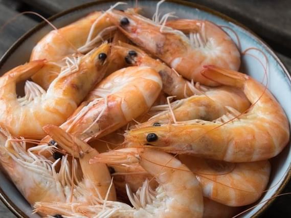 Close-up of shrimp dish served at a shop near La Galerie Hotel