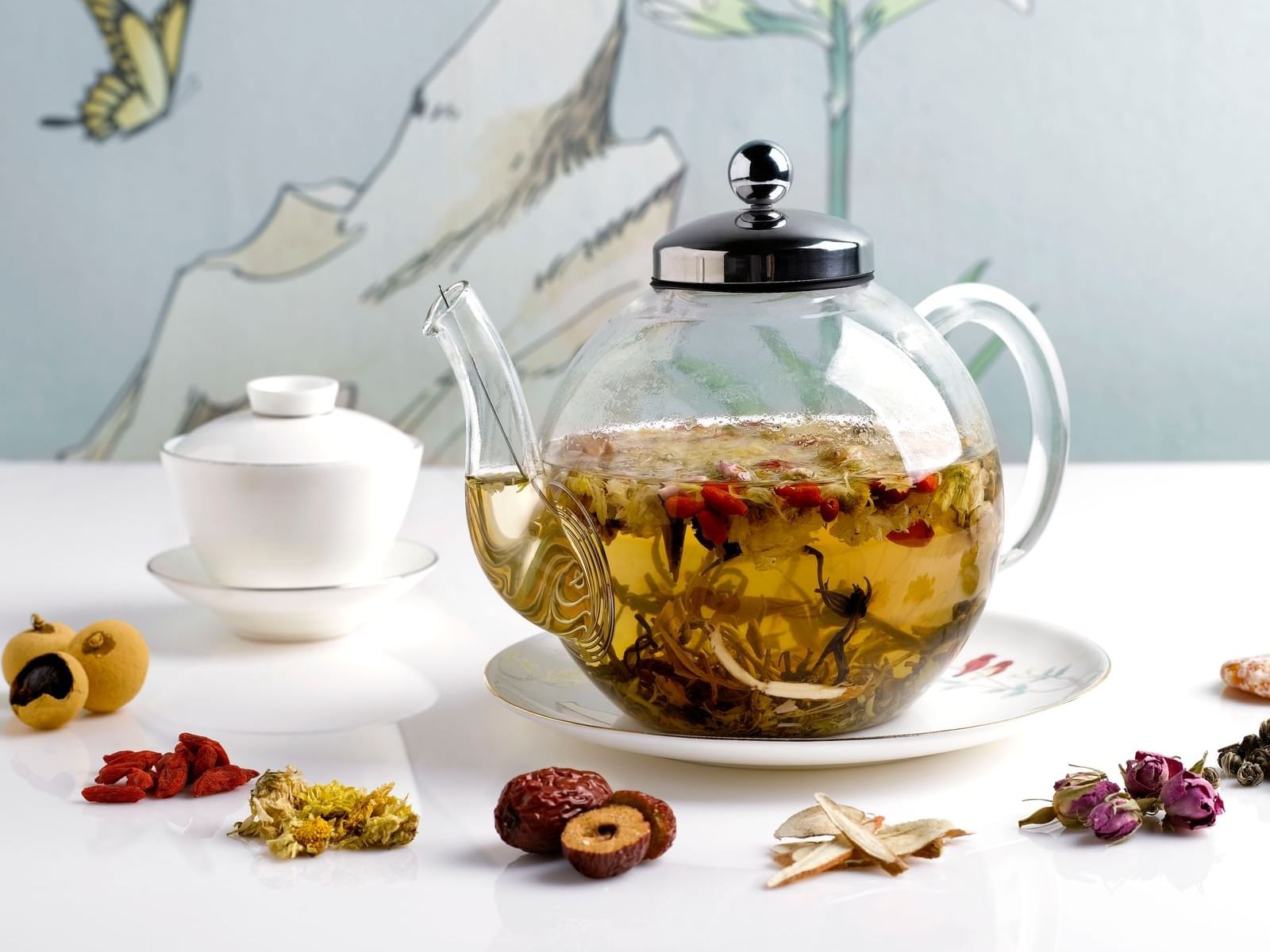 Tea pot with dried fruit on a table in The Straits Club at The Fullerton Hotel Singapore