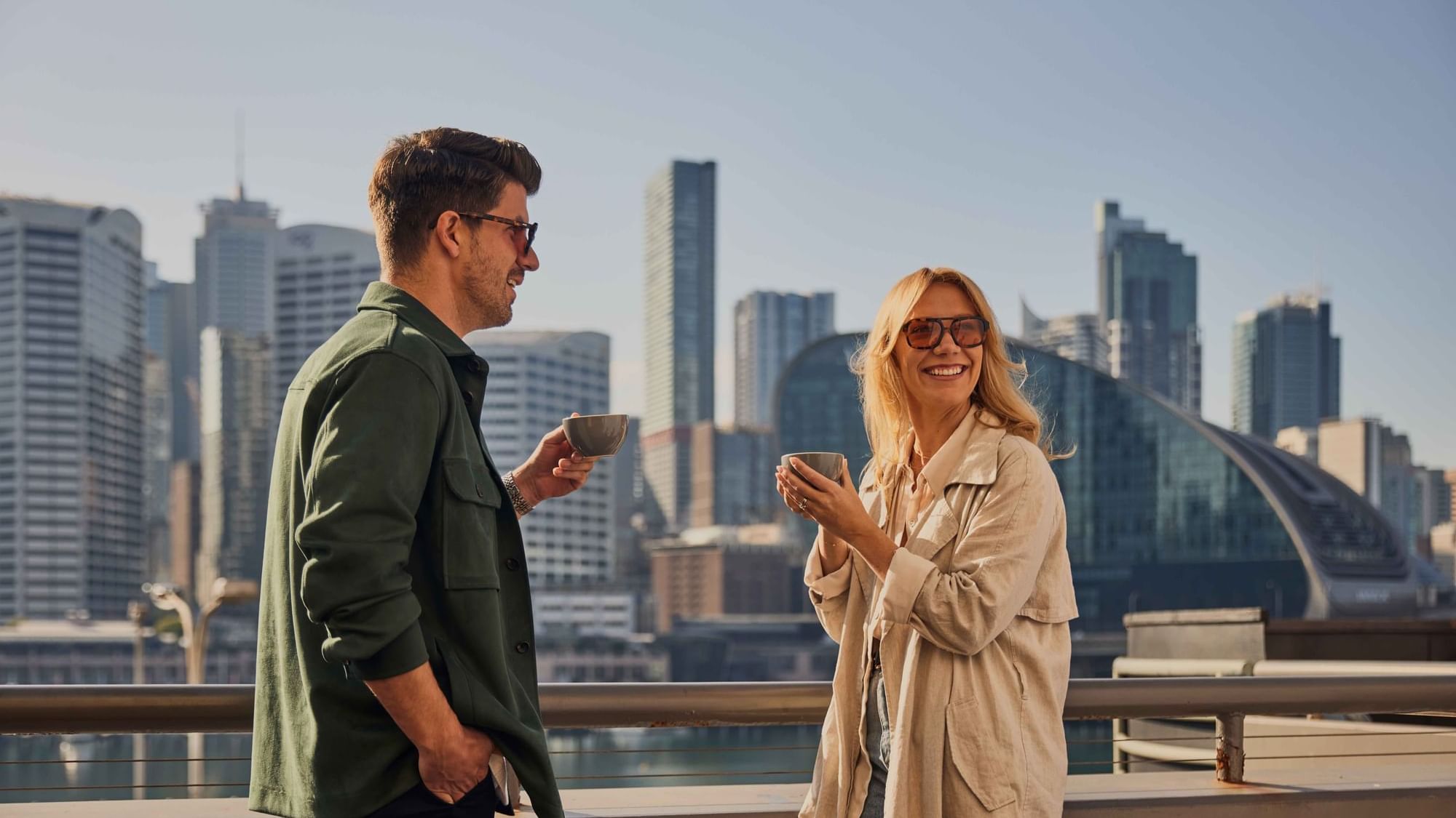 Couple enjoying sunset drinks on ibis bar deck